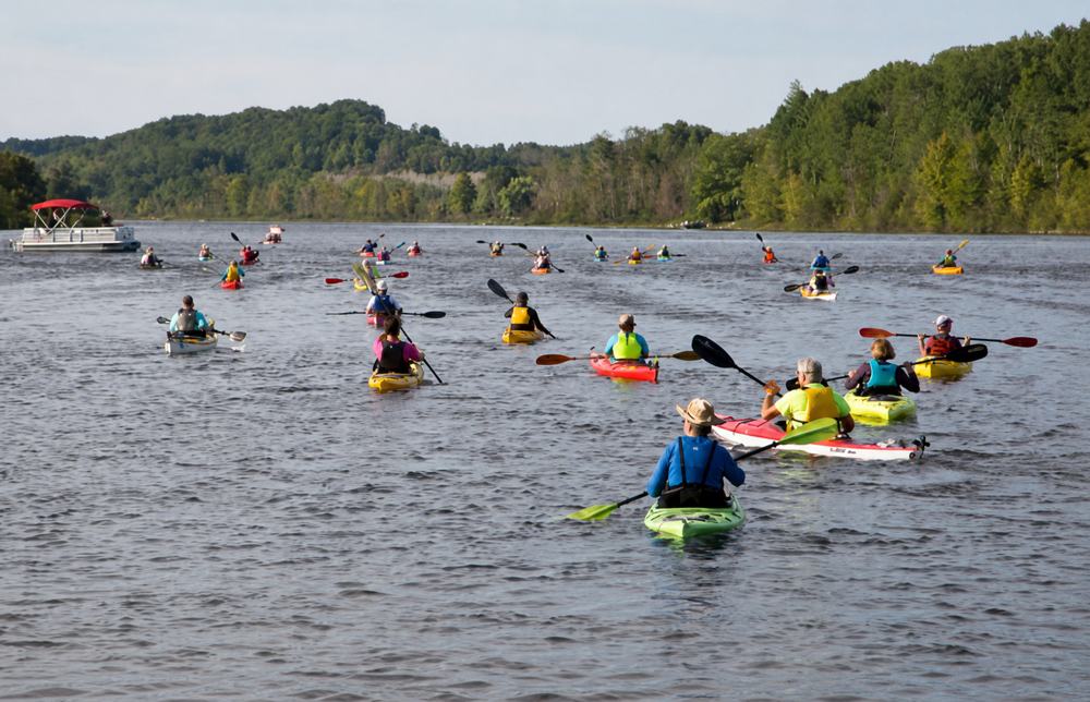 Paddlers kayaking on the Chain of Lakes Water Trail during the Paddle Antrim Festival