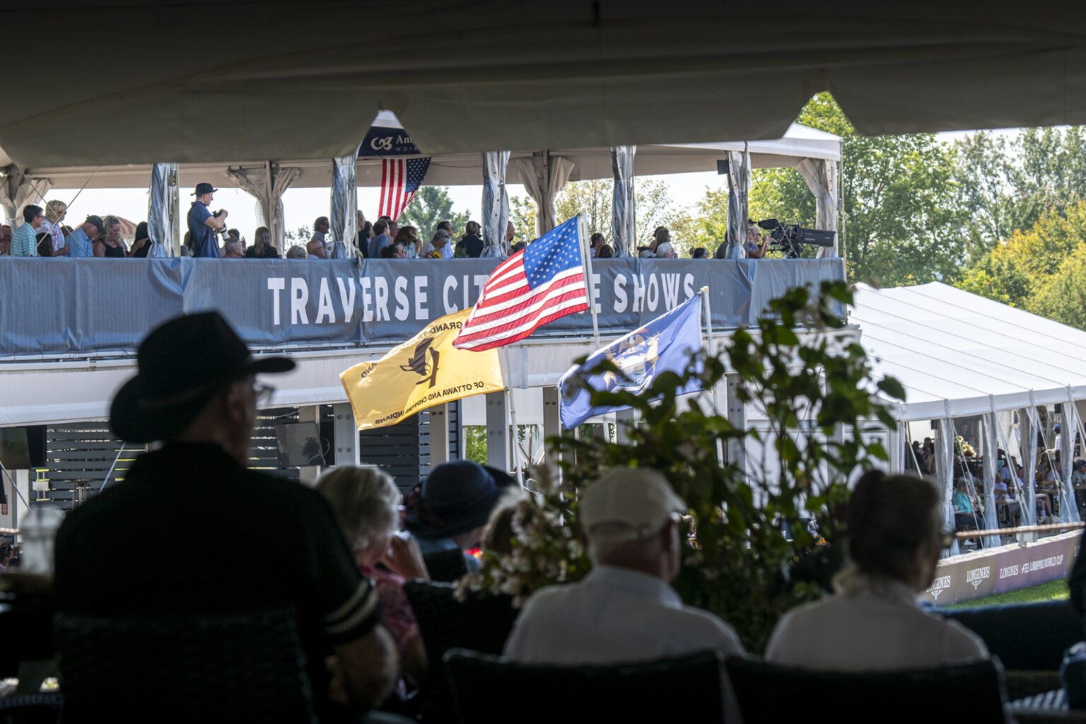 Spectators watching equestrian competition at Flintfields Horse Park